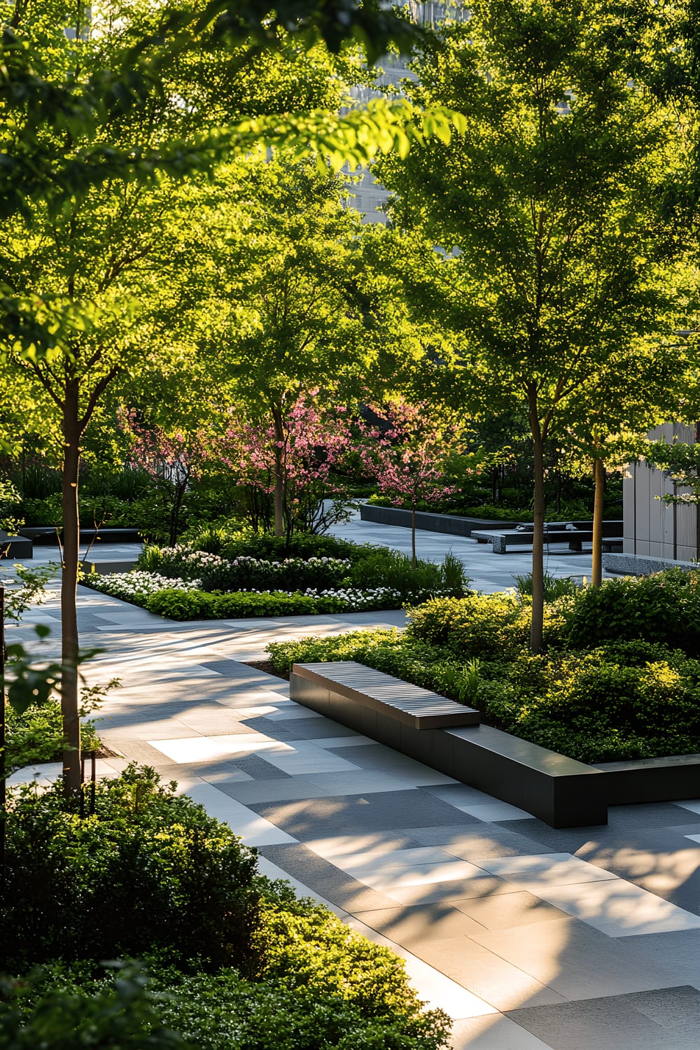 A modern arboretum featuring a curated selection of trees and shrubs, including dwarf Japanese maple and compact magnolia trees, as well as boxwood and hydrangea shrubs. A sleek stone pathway curves through the lush green space, leading to minimalist benches. Pathway lighting and spotlights create a warm atmosphere during the evening hours, while bright midday sunlight brings out the vibrant hues of the greenery. Red leaves of the Japanese maple and pink blossoms of the hydrangeas add touches of color to the scenery.