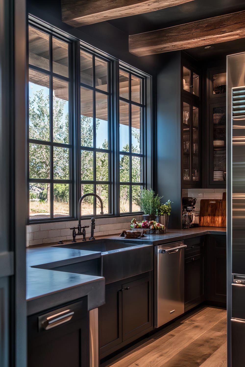 A modern farmhouse kitchen with dark espresso cabinets, blackened steel countertops, and a large industrial-style window. Exposed wooden beams and textured concrete flooring add a rustic touch, while stainless steel appliances blend seamlessly into the design. Dramatic pendant lights cast sharp shadows, enhancing the moody ambiance.