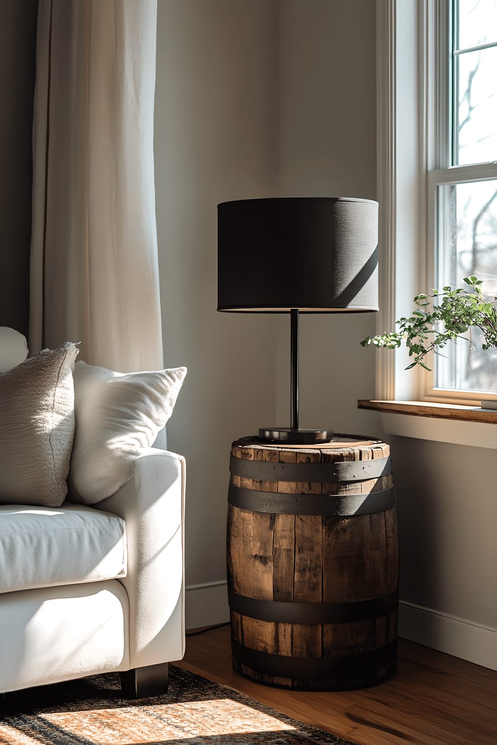 A close-up view of a repurposed wine barrel side table in a living room corner, decorated with a matte black metal lamp, illuminated by soft natural light from a nearby window, emphasizing the detailed craftsmanship and texture of the wood.