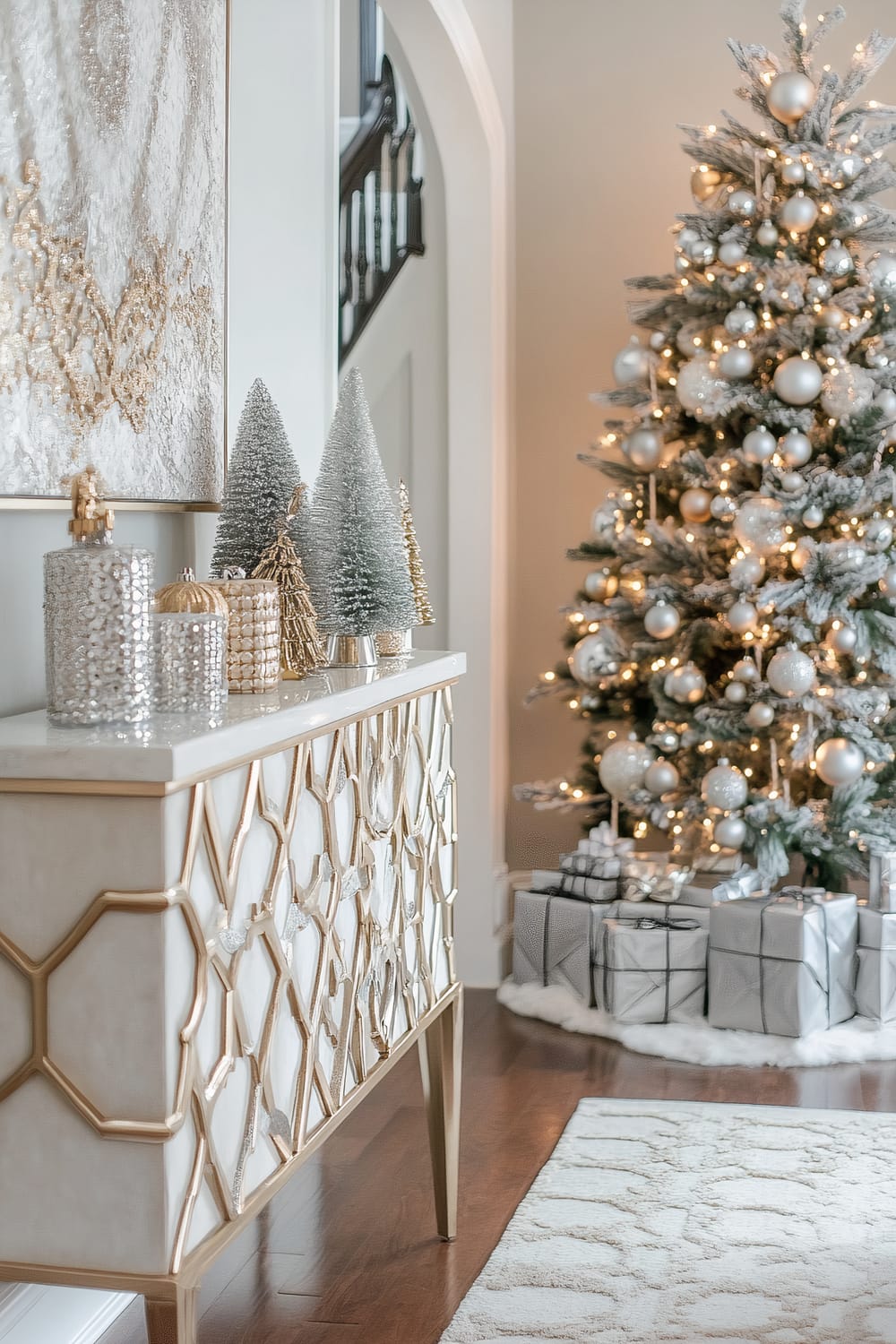 An elegantly decorated interior setting featuring a stylish sideboard adorned with miniature Christmas trees and decorative jars. In the background, a fully decorated Christmas tree with lights and ornaments stands next to meticulously wrapped gifts. The room has hardwood floors, a patterned white rug, and soft muted tones.