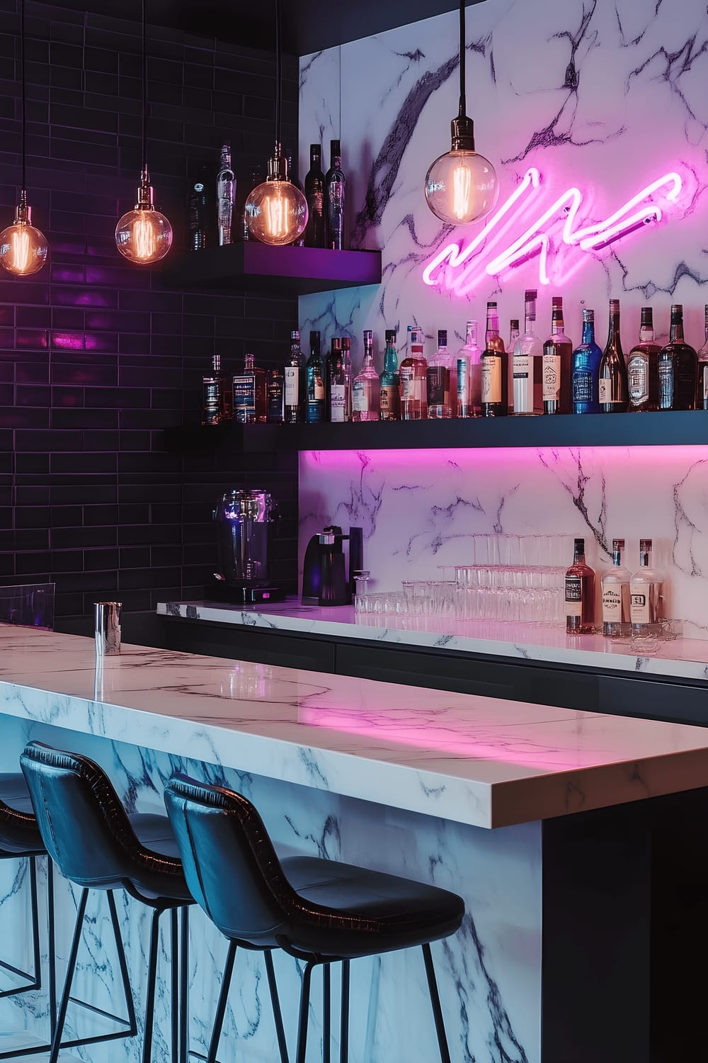 A stylish home bar in a Milan residence displaying a stunning white and grey marble countertop. Modern black bar stools with sleek chrome legs are arranged against the counter. Located behind the bar are open shelves presenting an array of colorful glassware and premium spirits housed in elegant glass bottles. A striking pink and blue neon sign imparts a modern, artistic touch, illuminating the bar with a jubilant radiance. The bar area is further enhanced with pendant lights boasting geometric metal shades and a minimalist black and white patterned backsplash. Adding to the décor sophistication is the tastefully staged glass decanter set.